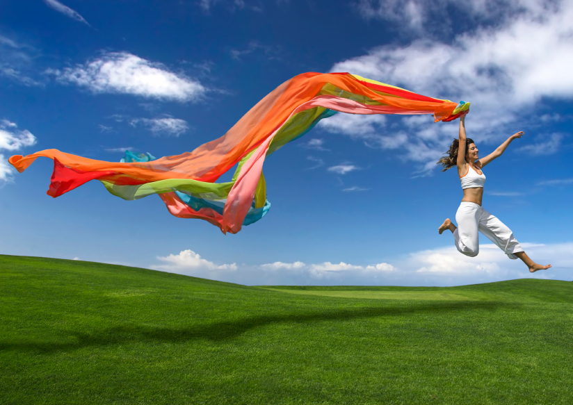 Lady in a field with a colourful scarf